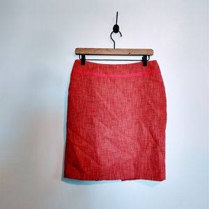 Context pink tweed pencil skirt with slit in the back size 6. Has a pull, shown